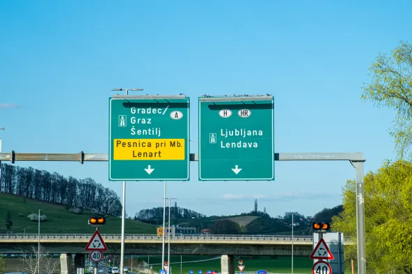 Slovenia motorway junction signs directing to Gradec Graz and Šentilj towards Austria, and Ljubljana and Lendava towards Hungary and Croatia, with exit for Pesnica pri Mb and Lenart, April 2026